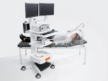 Metabolic testing workstation with canopy hood positioned over a patient.